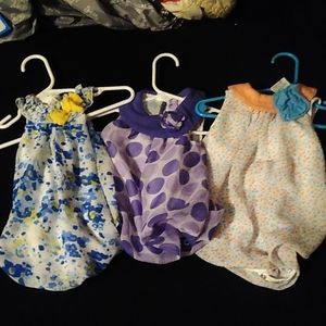 3 newborn dresses size 0-3 mths.